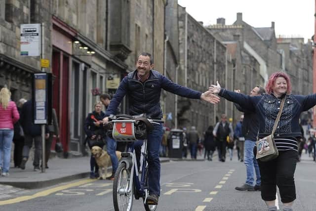 Olympic cyclist Chris Boardman enjoys a car-free day on the Canongate at a city council Open Streets even