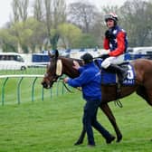 Jockey Jack Tudor after riding Kitty's Light to victory in the Coral Scottish Grand National Handicap Chase during the Coral Scottish Grand National festival at Ayr Racecourse.