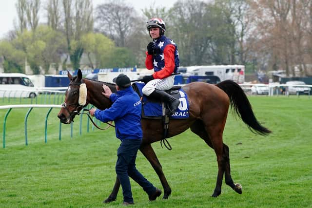 Jockey Jack Tudor after riding Kitty's Light to victory in the Coral Scottish Grand National Handicap Chase during the Coral Scottish Grand National festival at Ayr Racecourse.