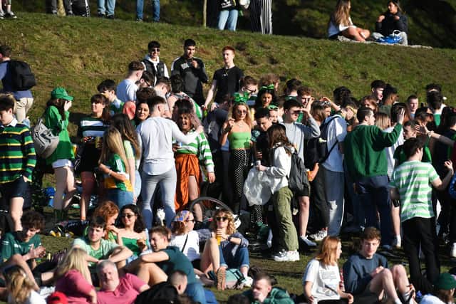 People congregate to celebrate St Patrick's Day in Kelvingrove Park in Glasgow.