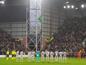 Both sides observe what proved a disrupted minute's silence at the start of the second half of Hearts v Istanbul Basaksehir. The Queen's death was announced at half-time of the Europa Conference League clash (Photo by Paul Devlin / SNS Group)