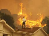 Wildfires are becoming an increasing threat in many parts of the world as the atmosphere heats up (Picture: David McNew/Getty Images)