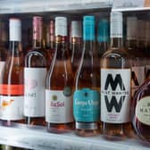 Bottles of wine are displayed for sale in a shop. (Photo by Carl Court/Getty Images)