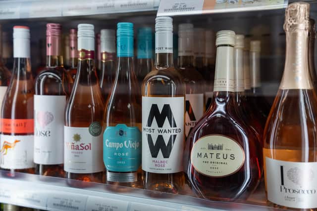 Bottles of wine are displayed for sale in a shop. (Photo by Carl Court/Getty Images)