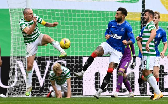 Celtic's Scott Brown (left) battles with Rangers defender Connor Goldson during the first Old Firm meeting of the season at Celtic Park on October 17. (Photo by Rob Casey / SNS Group)
