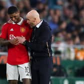Erik ten Hag, Manager of Manchester United, speaks with his player Marcus Rashford during the UEFA Europa League round of 16 leg two match between Real Betis and Manchester United at Estadio Benito Villamarin on March 16, 2023 in Seville, Spain. (Photo by Fran Santiago/Getty Images)