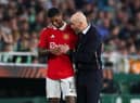 Erik ten Hag, Manager of Manchester United, speaks with his player Marcus Rashford during the UEFA Europa League round of 16 leg two match between Real Betis and Manchester United at Estadio Benito Villamarin on March 16, 2023 in Seville, Spain. (Photo by Fran Santiago/Getty Images)