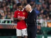 Erik ten Hag, Manager of Manchester United, speaks with his player Marcus Rashford during the UEFA Europa League round of 16 leg two match between Real Betis and Manchester United at Estadio Benito Villamarin on March 16, 2023 in Seville, Spain. (Photo by Fran Santiago/Getty Images)
