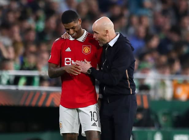 Erik ten Hag, Manager of Manchester United, speaks with his player Marcus Rashford during the UEFA Europa League round of 16 leg two match between Real Betis and Manchester United at Estadio Benito Villamarin on March 16, 2023 in Seville, Spain. (Photo by Fran Santiago/Getty Images)