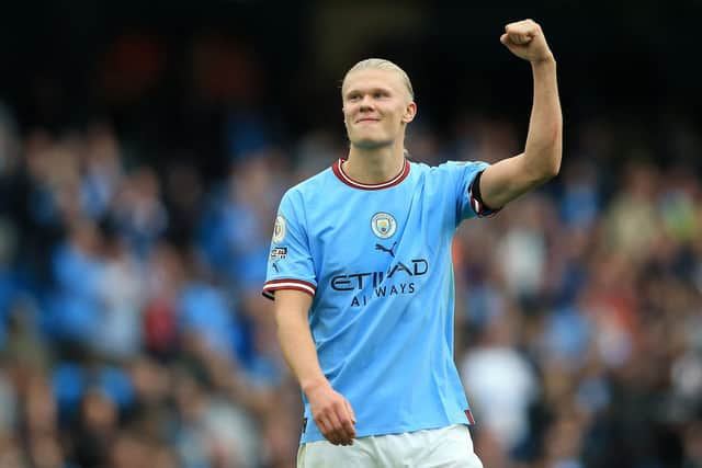 Erling Haaland celebrates after scoring one of his hat-trick of goals in the 6-3 win over Manchester United. (Photo by LINDSEY PARNABY/AFP via Getty Images)