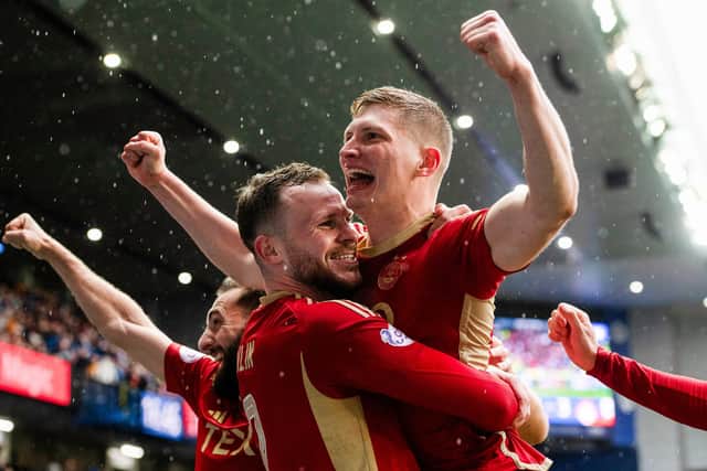 Aberdeen's Jack Mckenzie celebrates after scoring to make it 3-1 over Rangers at Ibrox. (Photo by Sammy Turner / SNS Group)
