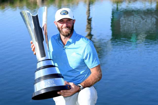 Dustin Johnson poses with the trophy after landing his second win in the Saudi International powered by SoftBank Investment Advisers at Royal Greens Golf and Country Club in King Abdullah Economic City. Picture: Ross Kinnaird/Getty Images.