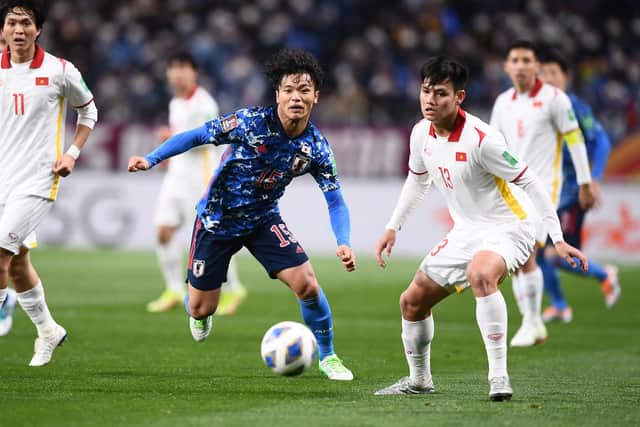 Celtic midfielder Reo Hatate fights for possession on his Japan debut against Vietnam.