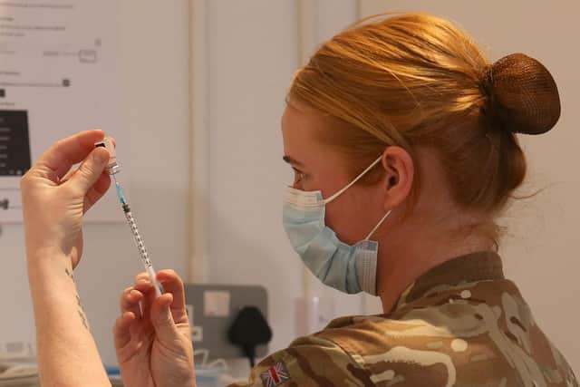 Lance corporal Amy Portman prepares a Covid-19 vaccine (Picture: Andrew Milligan/pool/AFP via Getty Images)