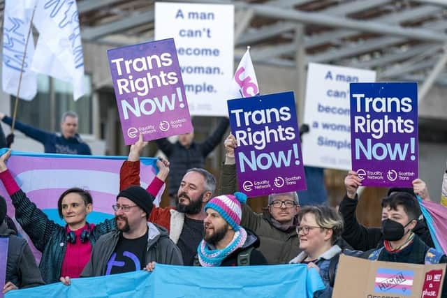 Members of the Scottish Family Party protest alongside supporters of the Gender Recognition Reform Bill (Scotland) outside the Scottish Parliament