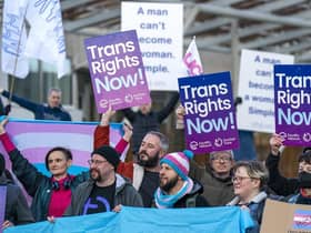 Members of the Scottish Family Party protest alongside supporters of the Gender Recognition Reform Bill (Scotland) outside the Scottish Parliament