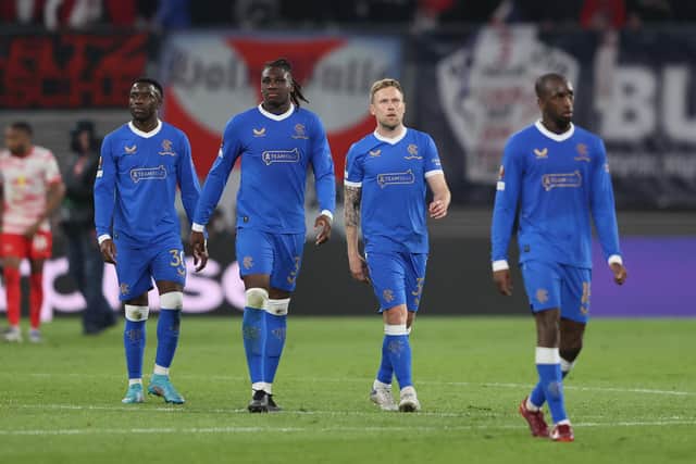 Rangers players (left to right) Fashion Sakala, Calvin Bassey, Scott Arfield and Glen Kamara look downcast after the 1-0 defeat against RB Leipzig in Germany on Thursday night. (Photo by Martin Rose/Getty Images)