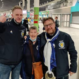 Moira Brown (centre) with fellow Scotland fans Alistair Firth and James Lall