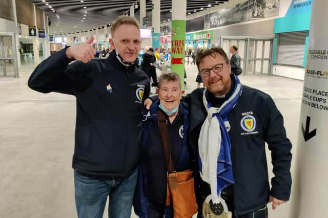 Moira Brown (centre) with fellow Scotland fans Alistair Firth and James Lall