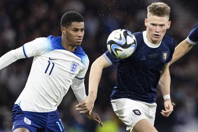 England's Marcus Rashford (L) and Scotland's Scott McTominay in action during the 150th Anniversary Heritage Match at Hampden Park. (Photo by Ross MacDonald / SNS Group)