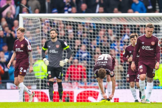 The dejected Hearts players look on during the 2-0 defeat by Rangers at Hampden.