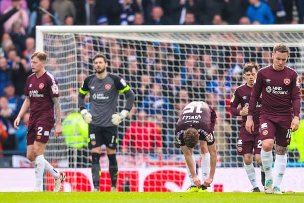 The dejected Hearts players look on during the 2-0 defeat by Rangers at Hampden.
