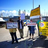 Campaigners outside Portland Port in Dorset before the first asylum seekers arrive to board the Bibby Stockholm accommodation barge.