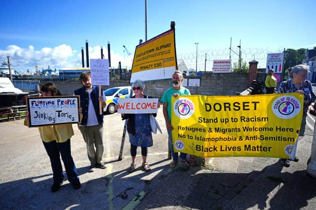 Campaigners outside Portland Port in Dorset before the first asylum seekers arrive to board the Bibby Stockholm accommodation barge.