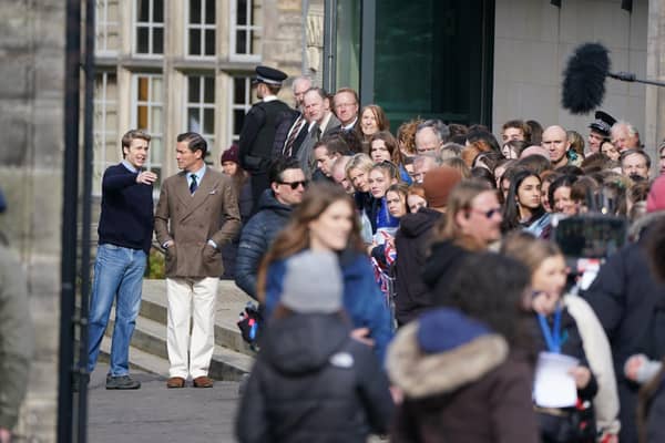 Ed McVey, playing the part of Prince William and Dominic West playing the part of Prince of Wales as they film scenes for the next season of The Crown in St Andrews, Scotland.