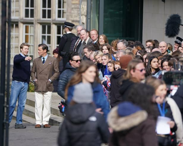 Ed McVey, playing the part of Prince William and Dominic West playing the part of Prince of Wales as they film scenes for the next season of The Crown in St Andrews, Scotland.