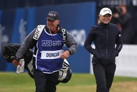 Louise Duncan and caddie Dean Robertson walk from the 1st tee during day one of the AIG Women's Open at Muirfield. Picture: Charlie Crowhurst/Getty Images.