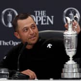 Xander Schauffele touches the Claret Jug during a press conference after winning the 152nd Open at Royal Troon. Picture: Kevin C. Cox/Getty Images.