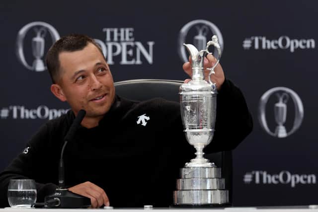Xander Schauffele touches the Claret Jug during a press conference after winning the 152nd Open at Royal Troon. Picture: Kevin C. Cox/Getty Images.