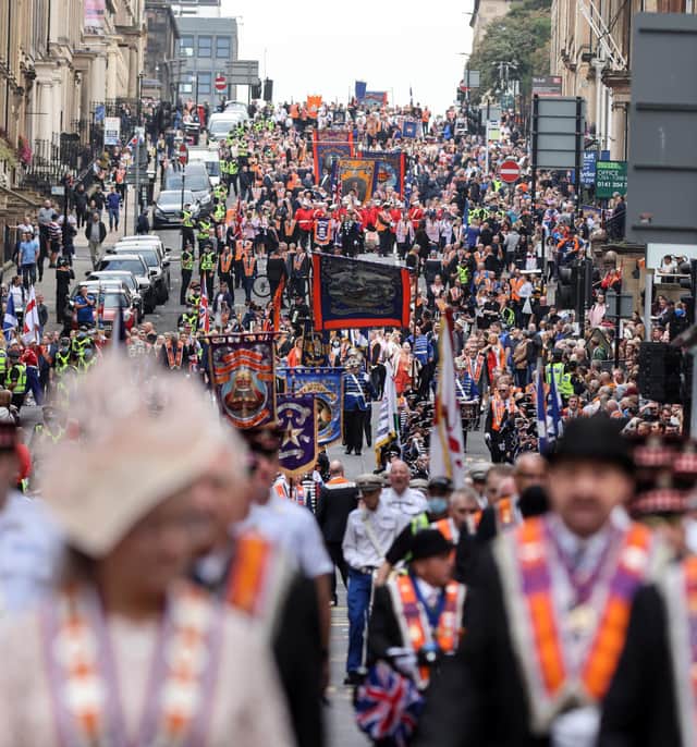 Members of the County Grand Orange Lodge take part in the annual Orange walk parade through the city centre of Glasgow. Over 5,000 members are expected to take part in over 30 marches across the city, last years marches were unable to take place due to coronavirus restrictions relating to the size of outdoor gatherings (Photo: Robert Perry/PA Wire).
