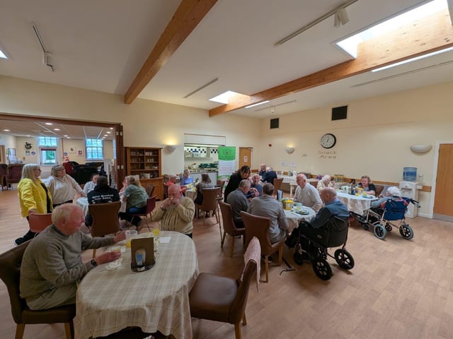 Members of Caring in Craigmillar enjoying the food.