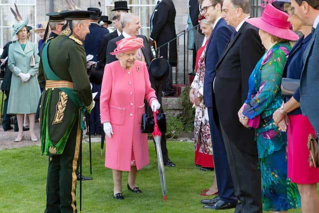 The Queen during a garden party at the Palace of Holyroodhouse h in 2019 (Jane Barlow/PA)