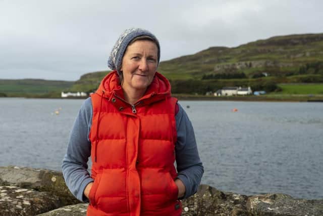Isebail MacKinnon, a lifelong resident of Canna, said visitors who have relied on the phonebox helped with the campaign to get the phone working again. PIC: Andrew O'Brien.