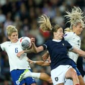 England's Rachel Daly (right) and Scotland's Erin Cuthbert battle for the ball.
