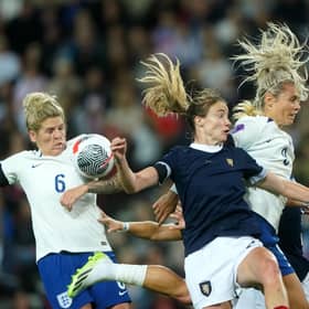 England's Rachel Daly (right) and Scotland's Erin Cuthbert battle for the ball.