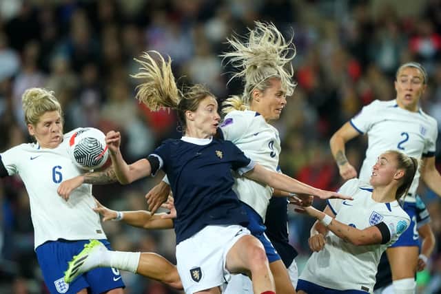 England's Rachel Daly (right) and Scotland's Erin Cuthbert battle for the ball.