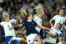England's Rachel Daly (right) and Scotland's Erin Cuthbert battle for the ball.