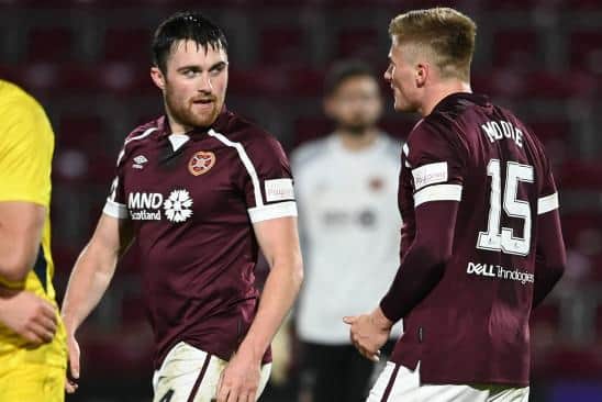 Hearts' John Souttar and Taylor Moore.  (Photo by Paul Devlin / SNS Group)