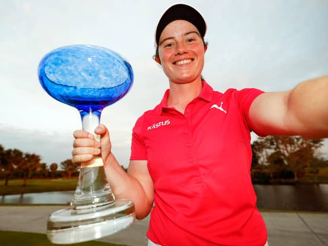 Leona Maguire of Ireland imitates a "selfie" as she poses with the trophy after winning the LPGA Drive On Championship at Crown Colony Golf & Country Club, Florida. (Photo by Douglas P. DeFelice/Getty Images)