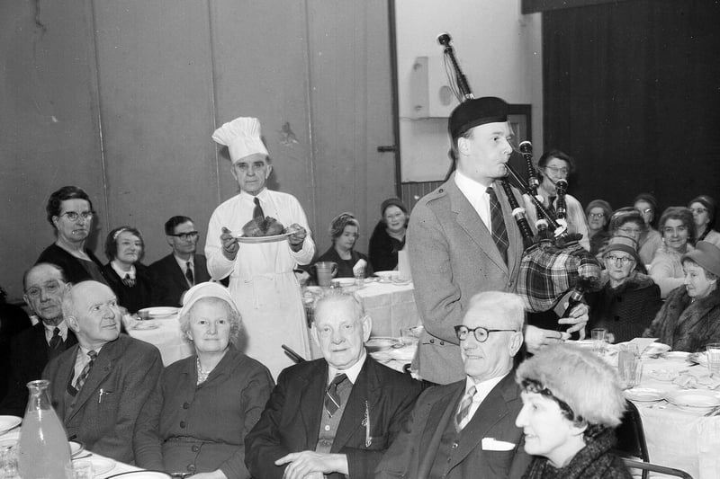 A piper pipes in the haggis at the Edinburgh Darby and Joan Club Burns Supper in 1963.