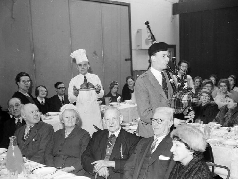 A piper pipes in the haggis at the Edinburgh Darby and Joan Club Burns Supper in 1963.