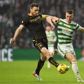 The tireless contribution of David Turnbull, seen here challenging Motherwell's Stephen O'Donnell, ought to see some old tropes retired. (Photo by Ross MacDonald / SNS Group)