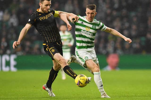 The tireless contribution of David Turnbull, seen here challenging Motherwell's Stephen O'Donnell, ought to see some old tropes retired. (Photo by Ross MacDonald / SNS Group)