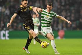 The tireless contribution of David Turnbull, seen here challenging Motherwell's Stephen O'Donnell, ought to see some old tropes retired. (Photo by Ross MacDonald / SNS Group)