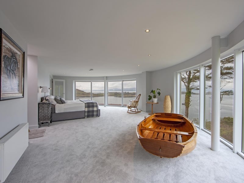 Upstairs comprises the principal bedroom suite and study space with access to a balcony