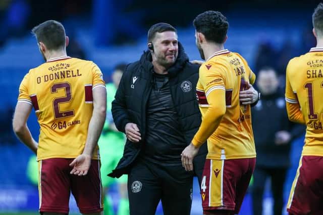 Motherwell assistant manager Chris Lucketti celebrates with Ricki Lamie at full-time following the 2-2 draw against Rangers at Ibrox. (Photo by Craig Williamson / SNS Group)